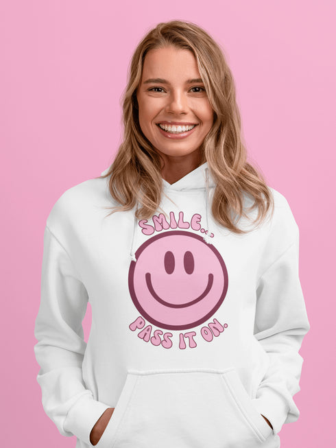 Introducing the ultimate mood booster in fabric form: the "Smile…Pass It On" Happy Face Hoodie! This isn't just any ordinary hoodie; it's a wearable ray of sunshine, guaranteed to spread joy, high-fives, and possibly even spontaneous dance-offs wherever you go.